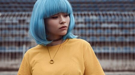 Asian teenager with blue hair
