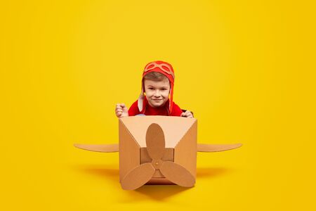 Confident little boy piloting planeの写真素材