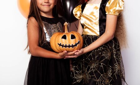 Faceless kids with decorated Jack o lanternの写真素材