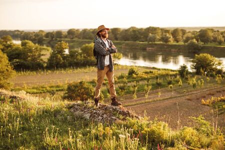 Confident explorer standing in nature