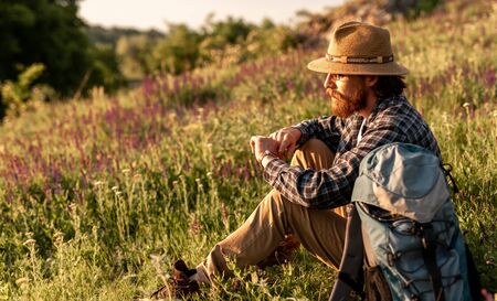 Discoverer checking time in countrysideの写真素材