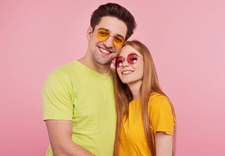 Cheerful young couple in sunglasses