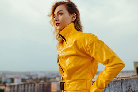 Futuristic woman on building roofの写真素材