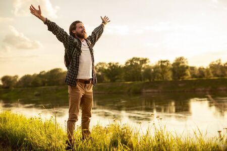 Happy traveler expressing love to natureの写真素材