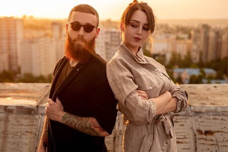 Confident stylish couple on rooftop