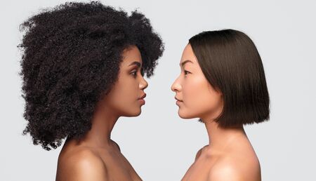 Diverse ladies looking at each other