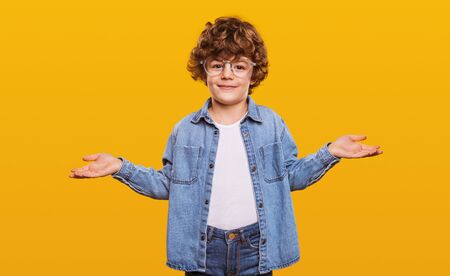 Cheerful cute boy making decision