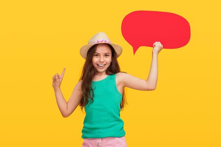Happy girl with empty speech bubble pointing up