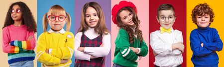 Multiethnic little girls and boys against colorful backgroundの写真素材