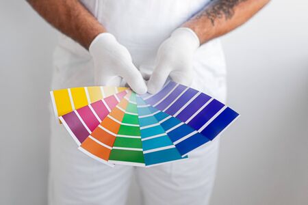 Male decorator holding color samplersの写真素材