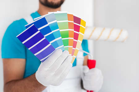 Professional decorator demonstrating colorful paletteの写真素材