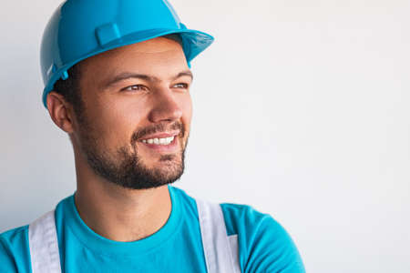 Positive male builder looking awayの写真素材