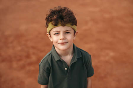 Little athlete looking at camera