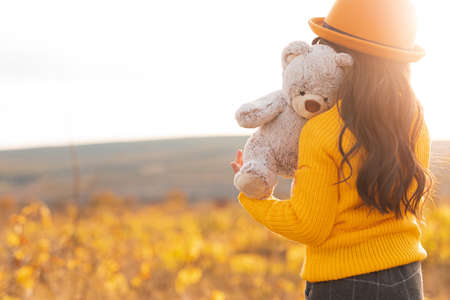 Anonymous child with toy in meadowの写真素材