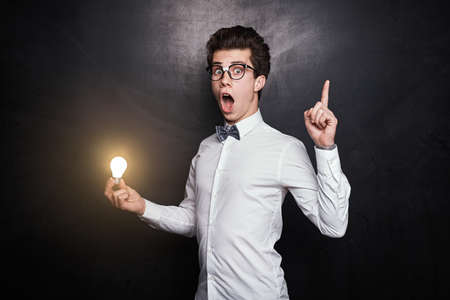 Smart male nerd having ideaの写真素材