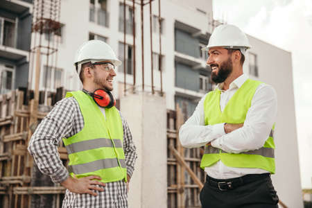 Happy builders speaking during break