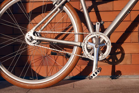 Bicycle parked near brick wallの写真素材