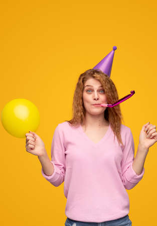 Young blond female celebrating birthdayの写真素材