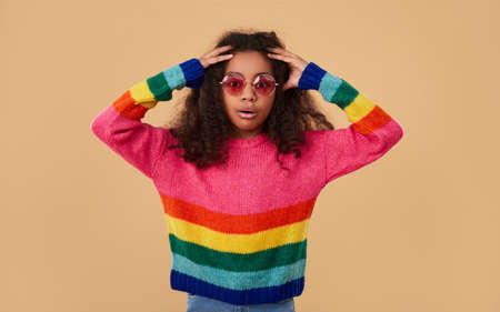 Shocked black girl touching headの写真素材