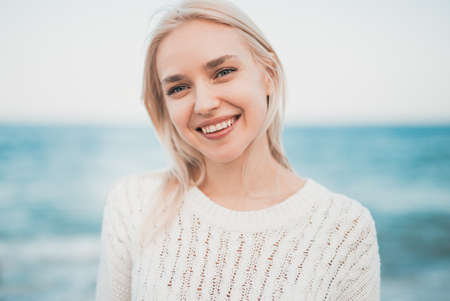 Happy woman resting near sea