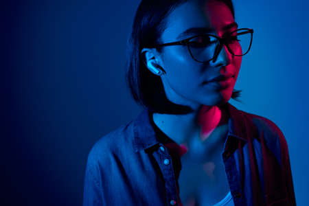 Young brunette listening to music with closed eyesの写真素材