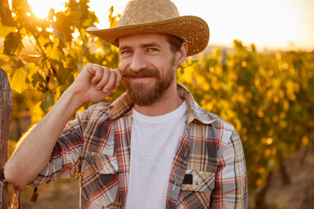 Positive winemaker curling mustache on farmの写真素材