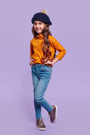 Cheerful girl in trendy casual outfit and beretの写真素材