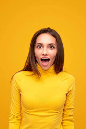 Amazed female yelling at cameraの写真素材