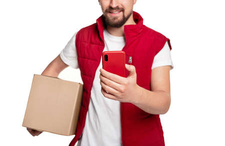 Delivery man with smartphone and box