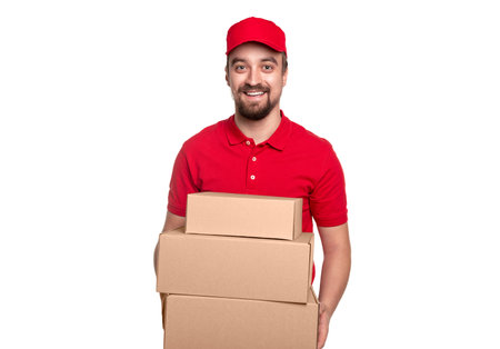 Happy delivery man with carton boxes