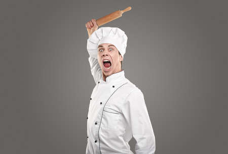 Funny brave chef with rolling pinの写真素材