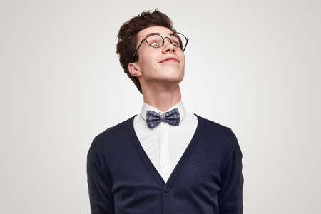 Proud nerd in glasses looking awayの写真素材