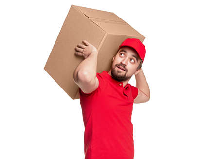Delivery man carrying cardboard box