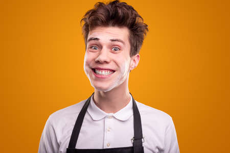 Crazy young male with wet faceの写真素材