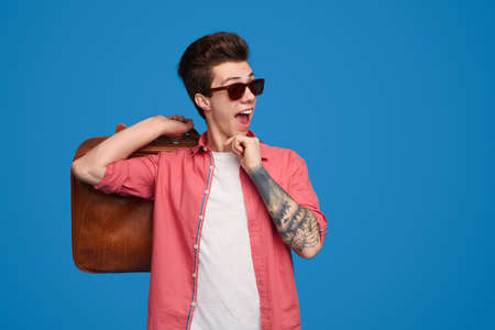 Funky man in sunglasses with bagの写真素材