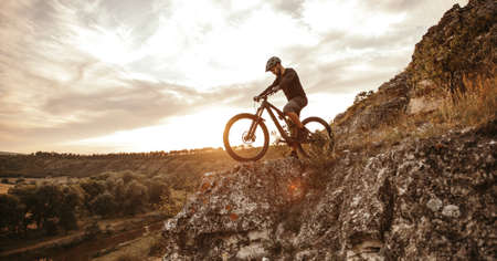 Man riding e bike in mountainsの写真素材