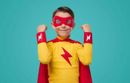 Excited superhero kid with funny faceの写真素材