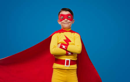 Confident kid in superhero costume and maskの写真素材