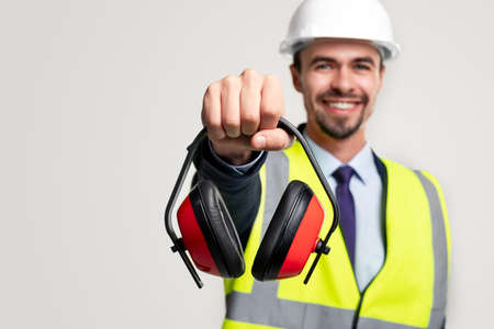 Happy construction engineer with protective headphonesの写真素材