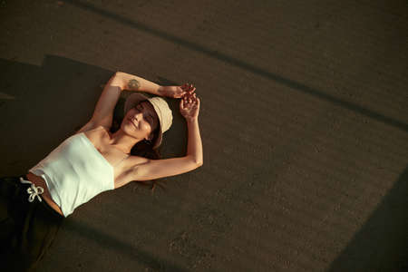 Young woman chilling on streetの写真素材