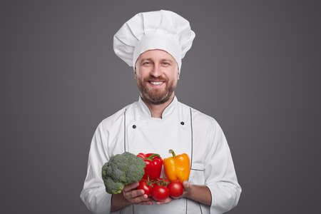 Happy chef with fresh vegetablesの写真素材