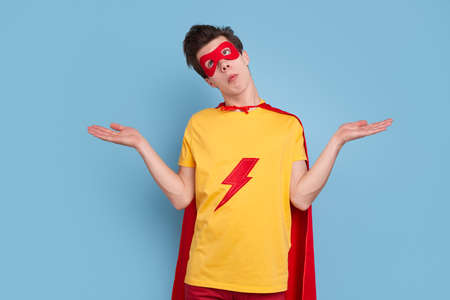 Unsure superhero in costume in studioの写真素材