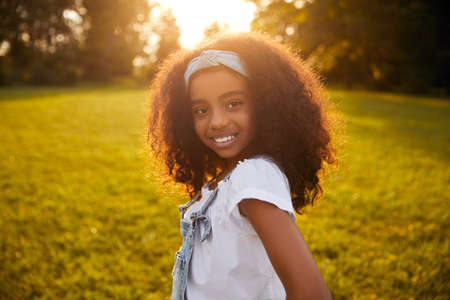 Black girl in summer parkの写真素材