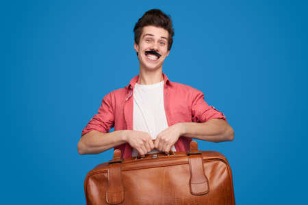 Cheerful nerd with backpackの写真素材