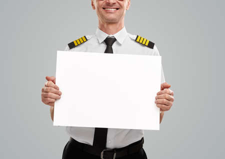 Crop aviator with blank sheet of paperの写真素材