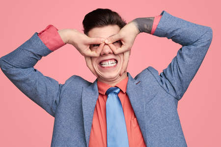 Excited man making facesの写真素材