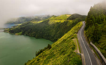 Road near lake in mountainsの写真素材