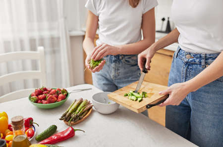 Mother and daughter cooking togetherの写真素材