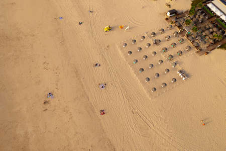 Scenery of parasols on sandy beachの写真素材
