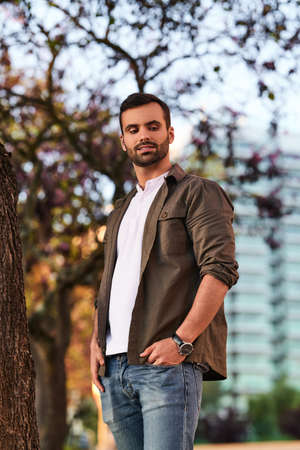 Glad ethnic man in parkの写真素材